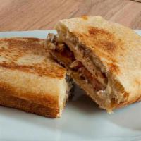 Chicken Ranch Panini · Grilled chicken breast, bacon, tomatoes, provolone and ranch dressing.