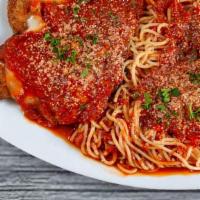 Chicken Parmigiana · Served with spaghetti and marinara.