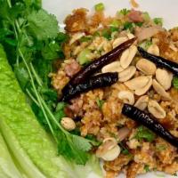  Lao Crispy Rice Salad (Nam Khao) · Gluten free. Deep fried crispy rice, sour pork, coconut flakes, lime, peanuts, cilantro, gre...