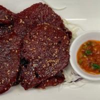 Beef Jerky (Siin Haeng) · Gluten free. Beef marinated with garlic and spices served with sticky rice or steam rice.