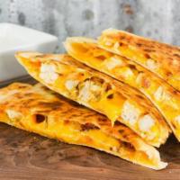 Homemade Quesadilla · Grilled tortilla, cheddar cheese. Served with a side of Salsa or Sour Cream.