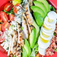 Chopped Cobb Salad · Grilled chicken breast, cherry tomatoes, eggs, sliced fresh avocado, bacon and crumbled gorg...