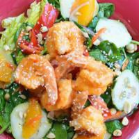 Sweet Thai Chili Shrimp Salad · Chopped romaine, shredded carrots, cucumbers, thin sliced red onions, red peppers, orange se...