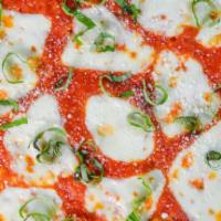 Margherita Pizza · Fresh Italian tomato sauce topped with grated Roman cheese and fresh mozzarella garnished wi...