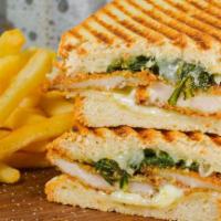 Chicken Milanese Panini · Homemade chicken cutlet, sautéed spinach, lemon mayo, and provolone cheese on Italian bread ...