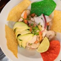 Ceviche · combination of white fish with herbs, lime juice, red onion, cilantro, fresh diced tomato & ...