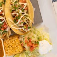 Chicken Taco · Three tacos filled with grilled chicken.