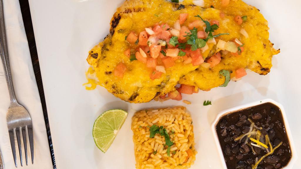 Pollo Veracruz · grilled chicken breast topped with pico de gallo & melted cheese, served with rice & black beans