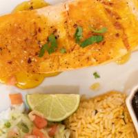 Chipotle Salmon · grilled salmon fillet with chipotle citrus sauce, Mexican rice, black beans and pico de gallo.