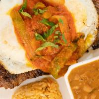 Amigo Steak · grilled skirt steak with fried eggs, onions & tomatoes, refried beans & Mexican rice