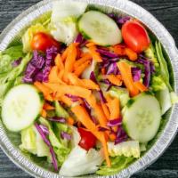 Garden Salad · Lettuce, tomatoes, red onion, cucumber, olives, with Italian dressing.