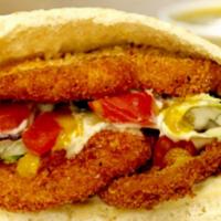 Schnitzel Sandwich · Thinly pound chicken breast, lightly breaded, seasoned, and fried. Served with your choice o...