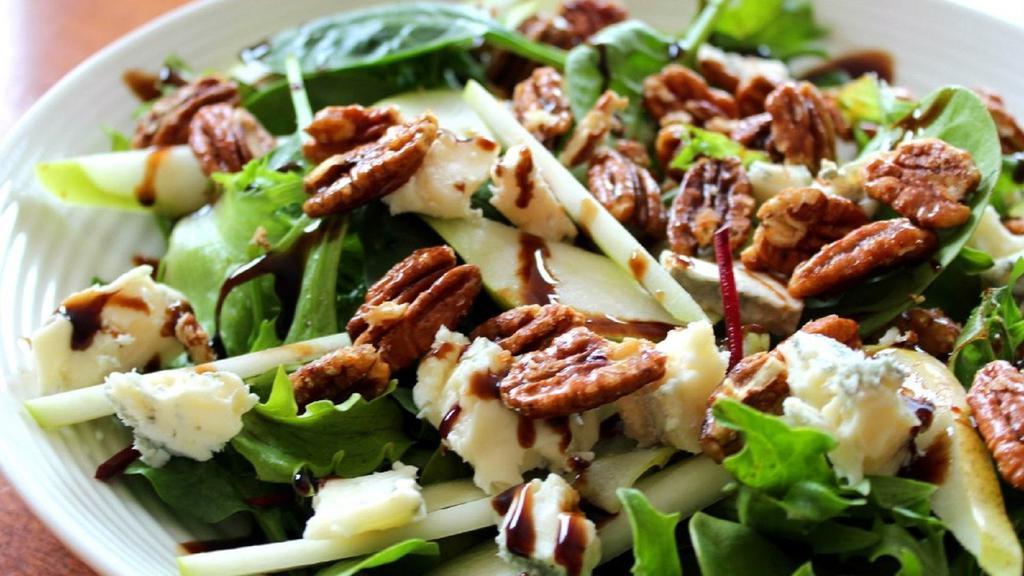 Roasted Pear Salad · Roasted pears, mixed greens, toasted walnuts, goat cheese, cranberries, and red onion, with pear vinaigrette dressing.