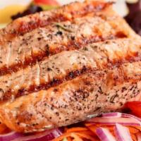 Grilled Salmon Platter · Marinated grilled salmon filet. Served with pita, your choice of french fries, rice, or a si...