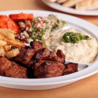 Lamb Kabob Platter · Grilled skewers of lamb seasoned with smoked spices and truffle oil. Served with pita, your ...