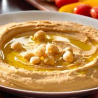 Hummus Platter · Our signature recipe of puréed chickpeas, tahini, lemon, and garlic. Served with pita, your ...
