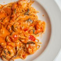 Shrimp Portofino · Shrimp with portobello mushrooms, sautéed in a sherry wine pink cream sauce. Served with hom...