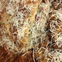 Meat Lasagna · Old-world style meat lasagna with ricotta cheese, Italian cold cuts, sliced meatball, and sw...