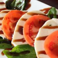 Caprese Salad · Fresh mozzarella, sliced tomatoes & basil balsamic glaze.