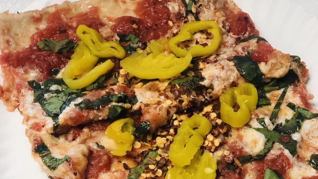 Brooklyn Style Sicilian Pizza · Large Thin crust square, chunky tomatoes, fresh mozzarella cheese, regular mozzarella, basil and olive oil.