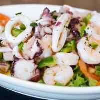 Marinated Seafood Salad · Marinated octopus, calamari, baby shrimp, red onions, celery and green peppers in a lemon ol...
