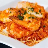 Shrimp & Scallops Fra Diavolo · Shrimp and scallops sautéed in a spicy red hot sauce, served over linguini.