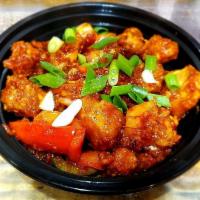 Chilli Chicken · Marinated chicken sautéed with green peppers & onions in chef's signature chilli sauce.