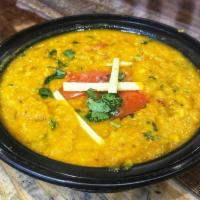 Tadka Dal · Lentils smoothly blended with tomatoes, onions & traditional Indian spices.