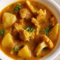 Aloo Ghobi · Cauliflower and potatoes cooked with mild spice & garnished with ginger root.