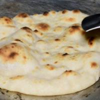 Butter Naan · White flour dough cooked with milk and butter.