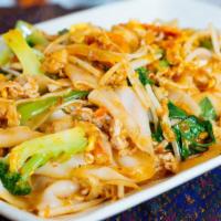 Crazy Noodles · Stir fried flat noodles with broccoli, cabbage, carrots, onions, and mushrooms in chili sauce.