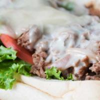 Philly Cheese Steak · 1/2 lb. of black Angus beef with grilled onions, lettuce and tomato, sweet peppers, mayo and...