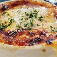 Baked French Onion Soup · garlic crostini and gruyere.