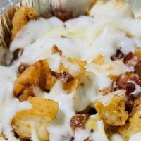 Mega Waffle Fries · Mozzarella, Cheese Whiz and bacon.