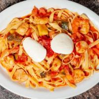 New Tagliatelle Positano · Shrimp, crabmeat, tomatoes, peas, tomato cream pink sauce.