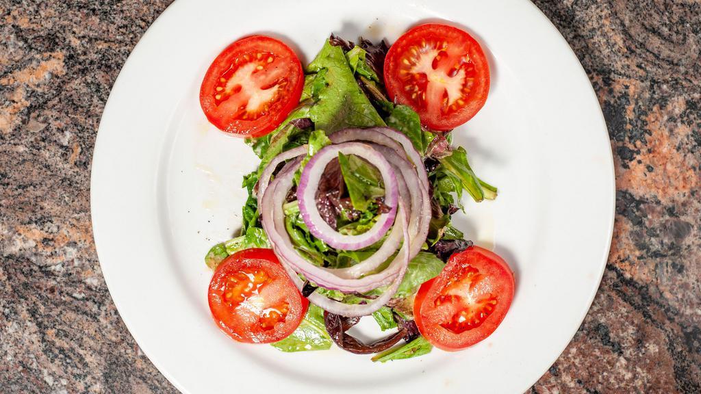 Insalata Mista · Spring mix, fresh sliced tomatoes, red onions, house dressing.