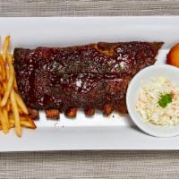 Louis Ribs Rack · A whole Rack of Tender St. Louis Style pork ribs basted with chef’s tangy BBQ sauce. Served ...