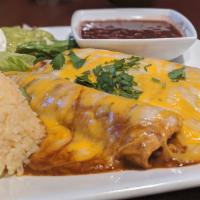 Mexican Enchiladas · Stuffed corn tortilla with red sauce and Mexican cheese, filled with shredded chicken. Serve...