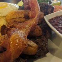 Plato Montañero · A hearty traditional Colombian plate that includes a grilled flank steak, fried egg pork rin...