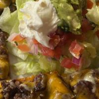 Steak Nacho · Served with melted cheese, beans, jalapenos, and a side of guacamole, sour cream, and pico d...