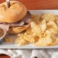 Hot Roast Beef Sandwich · Hand Carved USDA PRIME Hot Roast Beef sandwich Served with chips, & Au jus on side.