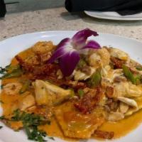 Lobster Ravioli Entree · Homemade lobster ravioli, finished in a vodka cream sauce with onions, prosciutto, & sundrie...