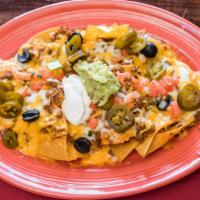 Border Nachos Not Your Lazy Nachos · Nachos prepared the traditional Texas way. Served with beans, mixed cheeses, lettuce, pico D...