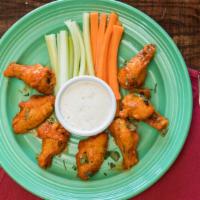 Buffalo Wings · Sweet and sour spicy hot wings served with ranch dressing and your choice of regular or bone...