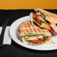 Chicken Panini · Pesto, roasted red peppers, tomatoes and provolone. Served on a ciabatta.