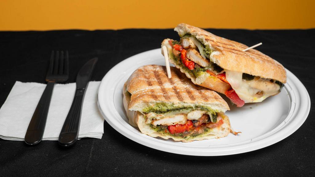 Chicken Panini · Pesto, roasted red peppers, tomatoes and provolone. Served on a ciabatta.