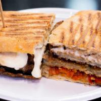 Eggplant Panini · breaded eggplant with fresh mozzarella, roasted red peppers, tomatoes ,and balsamic vinagret...
