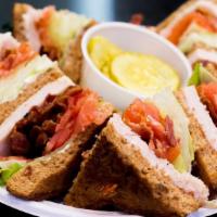 Turkey Club · Oven roasted turkey. Includes lettuce, tomatoes, mayo and bacon served with chips.