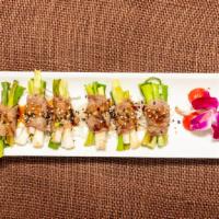 Grill Beef Scallion Roll · (8 pcs.) Thinly sliced beef wrapped around scallion grilled and served with teriyaki sauce.