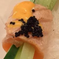 Salmon Tataki-Kyu Roll · (5 pcs.) seared salmon sashimi with sesame and black pepper rolled with cucumber. Served wit...